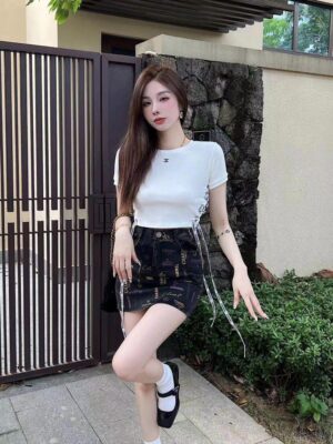 Chanel All-Over Logo Print Black Mini Skirt with Ribbon Ties — Women's Luxury Designer Skirt Chanel All-Over Logo Print Black Mini Skirt with Ribbon Ties — Women's Luxury Designer Skirt